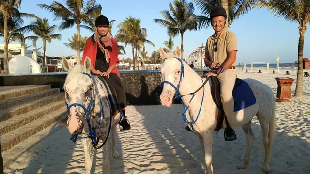 Two horse riders near the Hawana waterfront