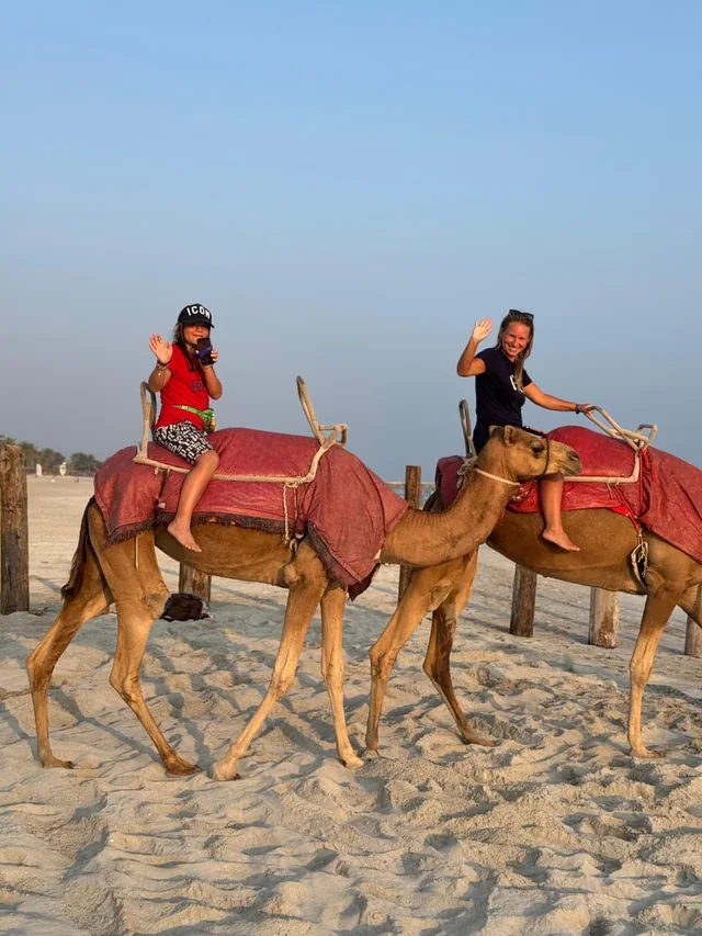 Camel rider beside Salalah dunes