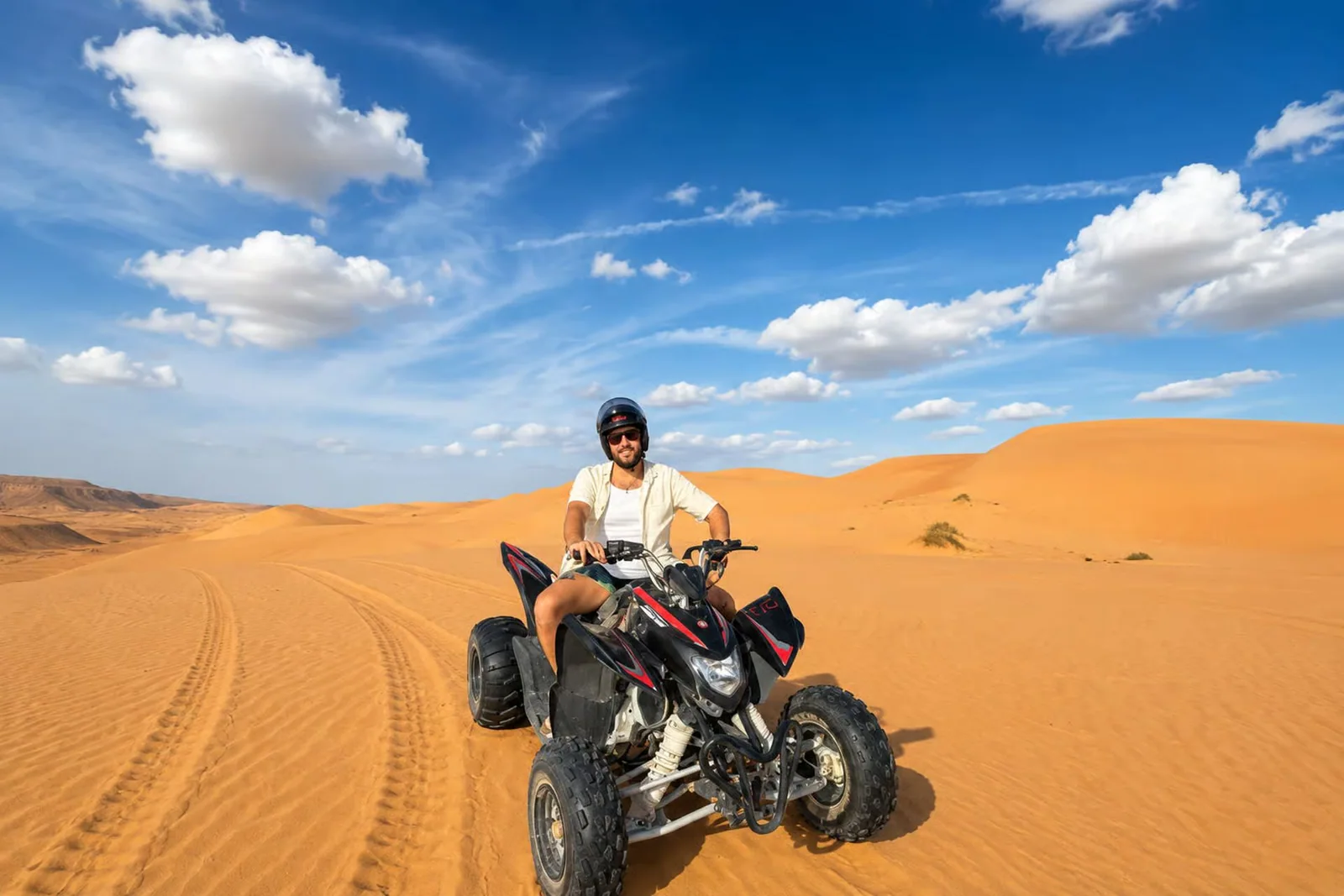 A quad bike among desert dunes